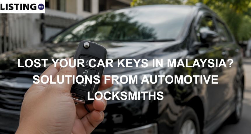 Hand holding a car key fob in front of a black car