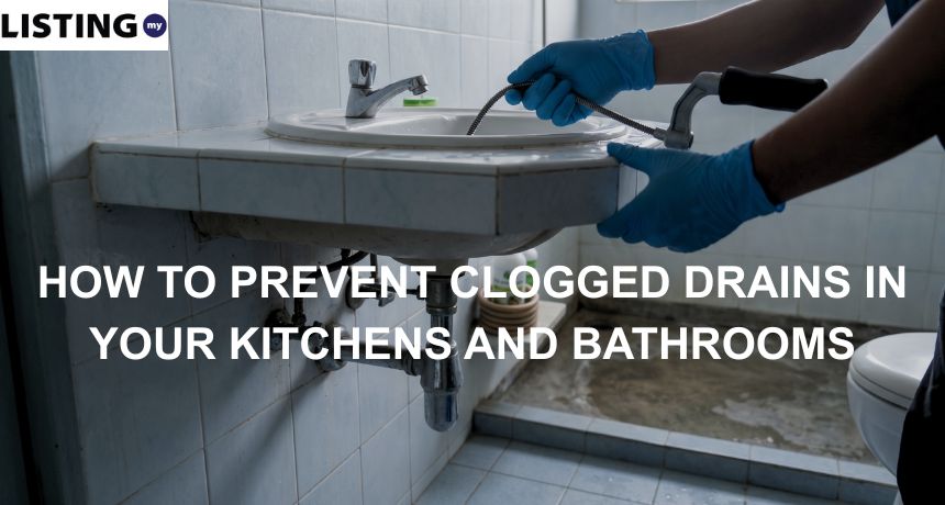 a plumber unclogging a drainage pipe in the bathroom