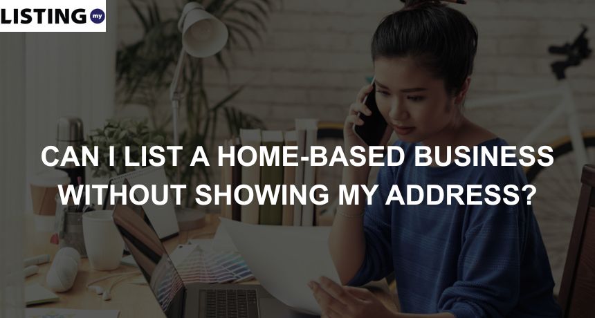 Photo of a woman on a phone call in front of a laptop, as she manages her home business