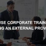 A photo of a corporate training who is conducting a session with trainees