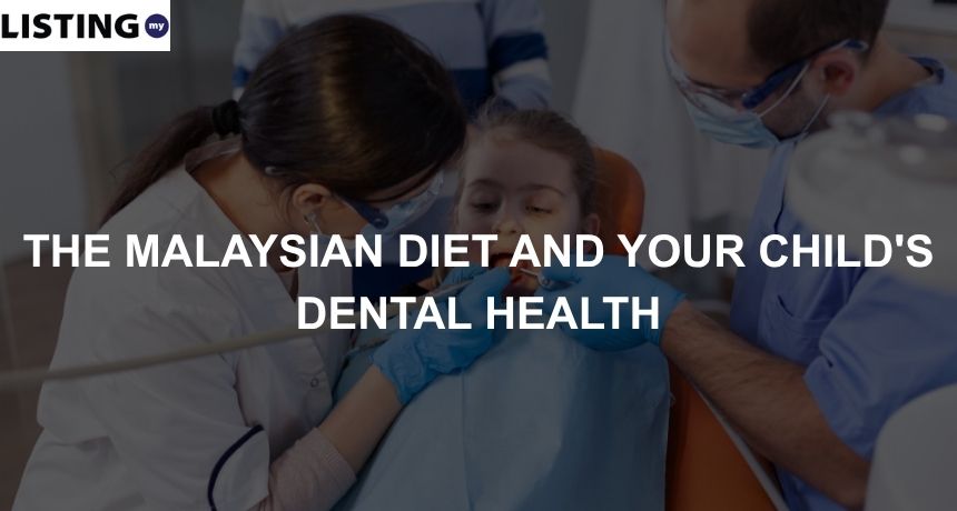 A pediatric dentist and her assistant inspect a child's teeth